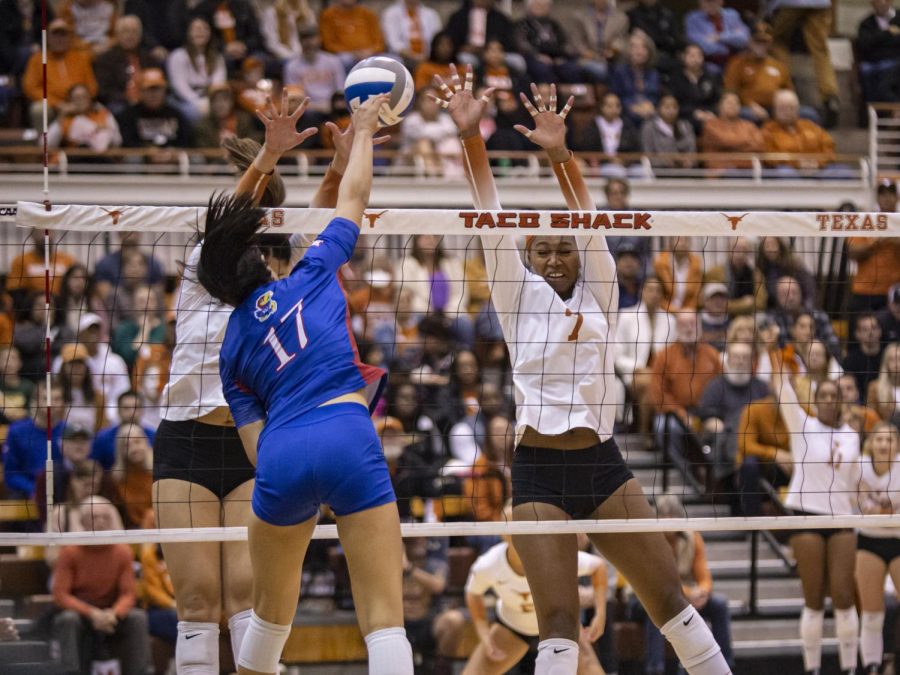  A picture of a team block the opposing teams spike